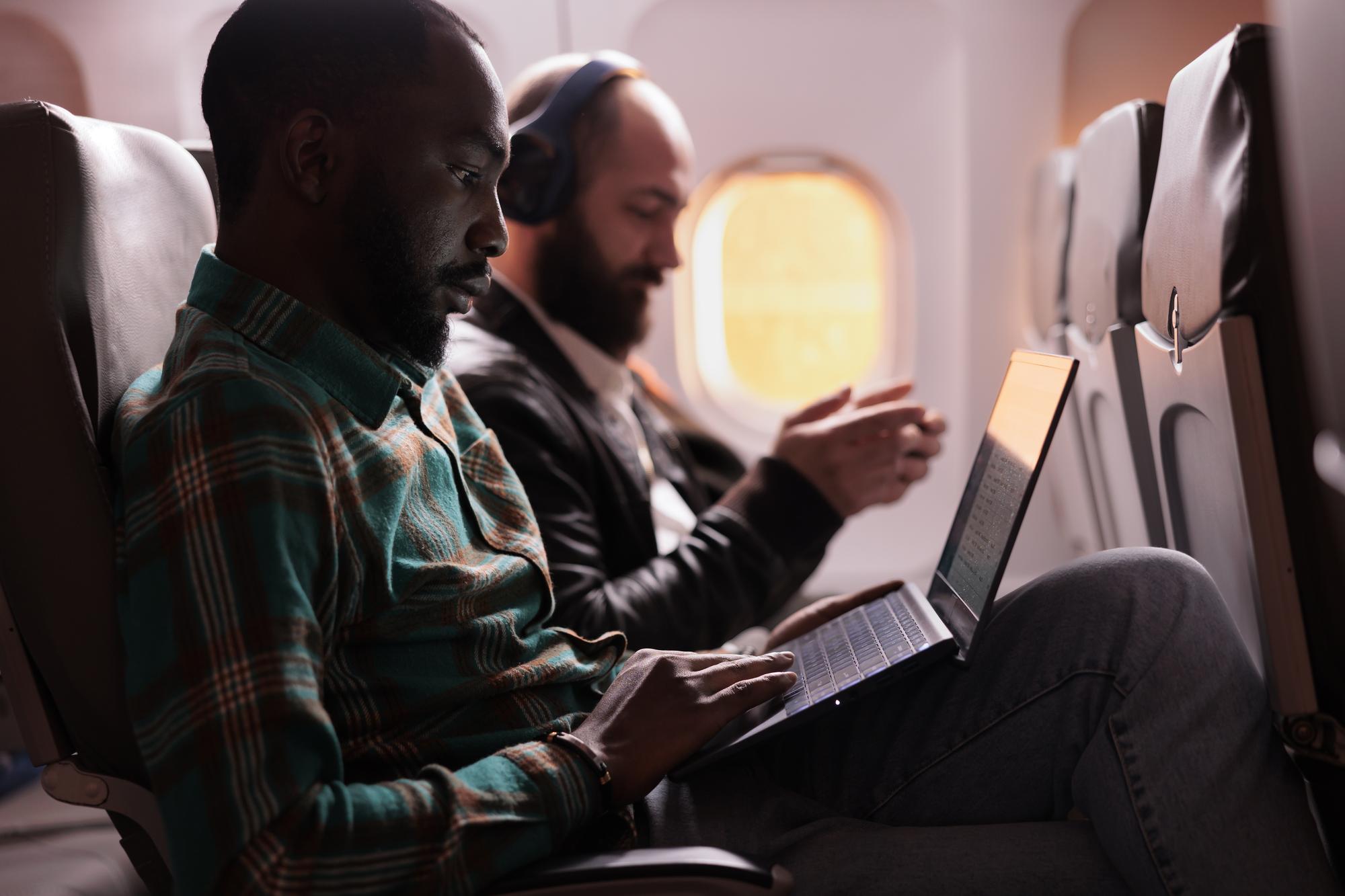 african-american-passenger-working-flight-explore-the-world